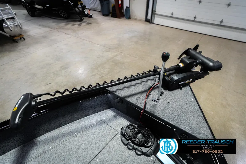 Slide: The Image of 2026 Lund 1700 Explorer SS boat with Minn Kota trolling motor in a showroom. - 49