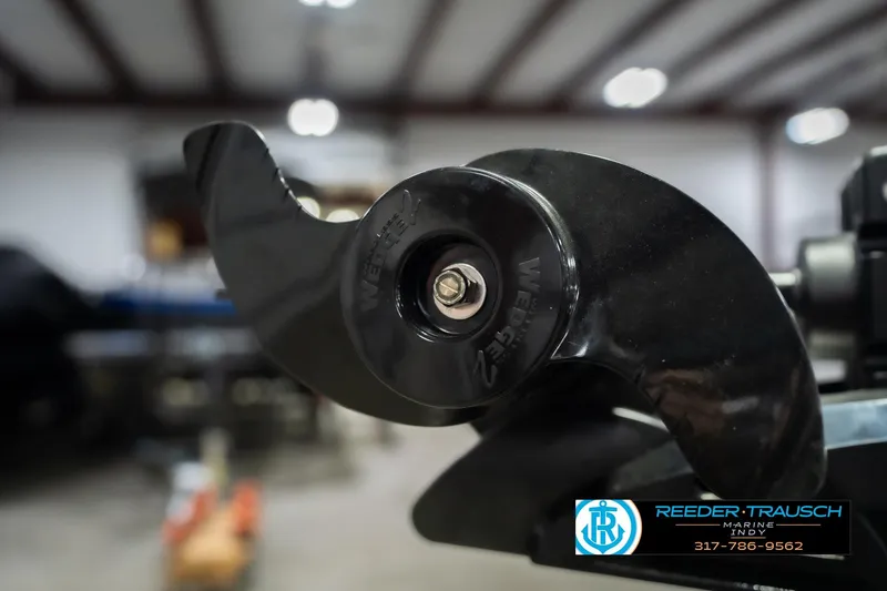 Slide: The Image of Close-up of a 2026 Lund 1700 Explorer SS boat propeller in a workshop. - 52