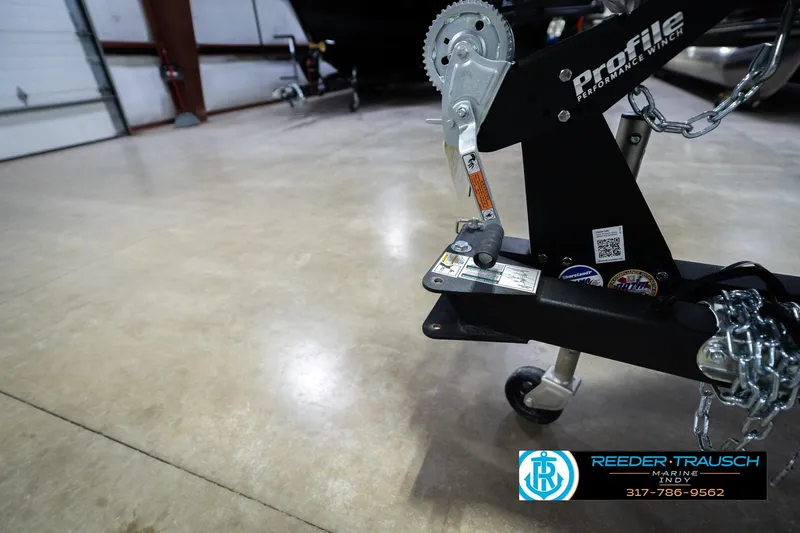 Slide: The Image of 2026 Lund 1700 Explorer SS trailer with Profile Performance Winch in a garage. - 56