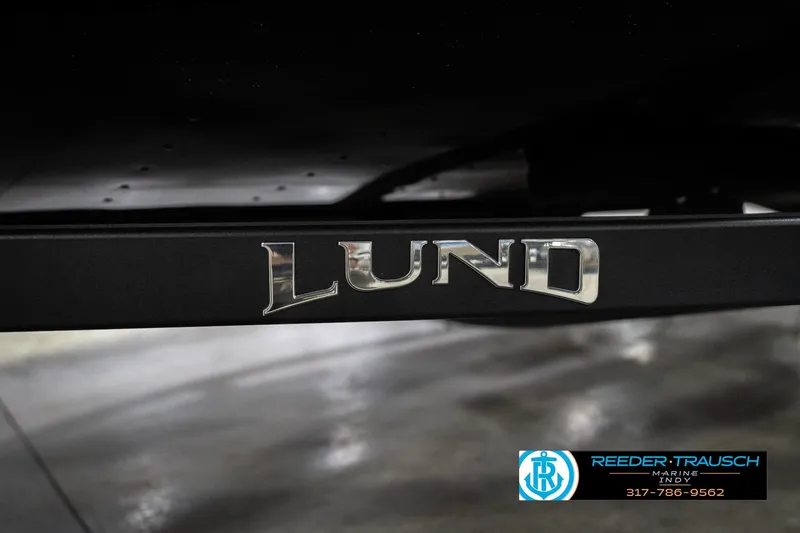Slide: The Image of 2026 Lund 1700 Explorer SS boat trailer with logo, Reeder Trausch Marine contact info. - 57