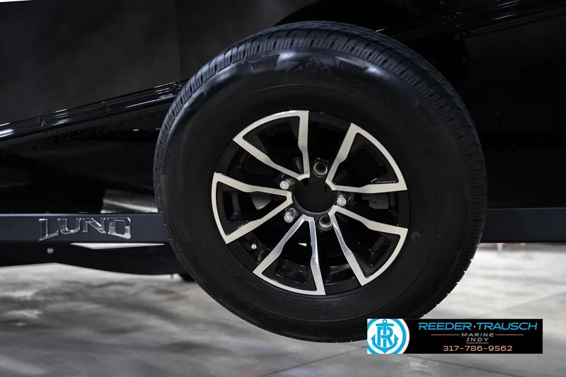 Slide: The Image of 2026 Lund 1700 Explorer SS trailer wheel with sleek black and silver design. - 64