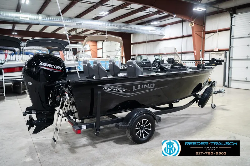 Slide: The Image of 2026 Lund 1700 Explorer SS boat with Mercury engine in showroom. - 7