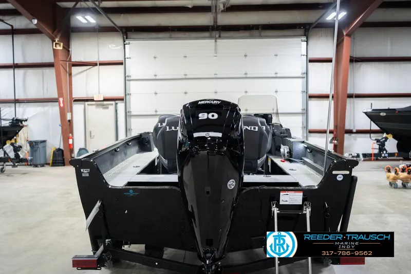 Slide: The Image of 2026 Lund 1700 Explorer SS boat with Mercury 90 engine in a showroom. - 8