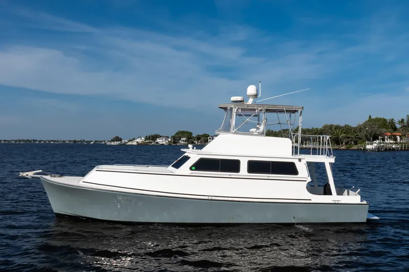 The Image of 2014 Chesapeake 46 Trawler on calm waters under a clear blue sky. - 0