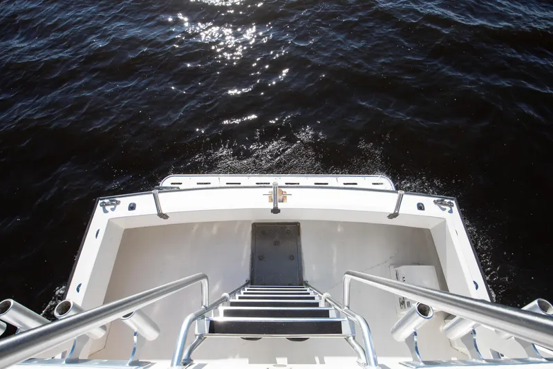 Slide: The Image of View from Chesapeake 46 Trawler's deck, 2014 model, overlooking calm water. - 18