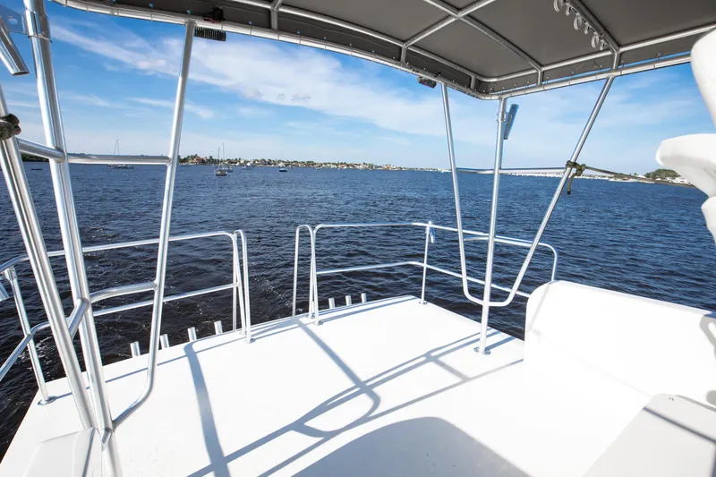 Slide: The Image of View from 2014 Chesapeake 46 Trawler deck overlooking calm blue waters. - 24