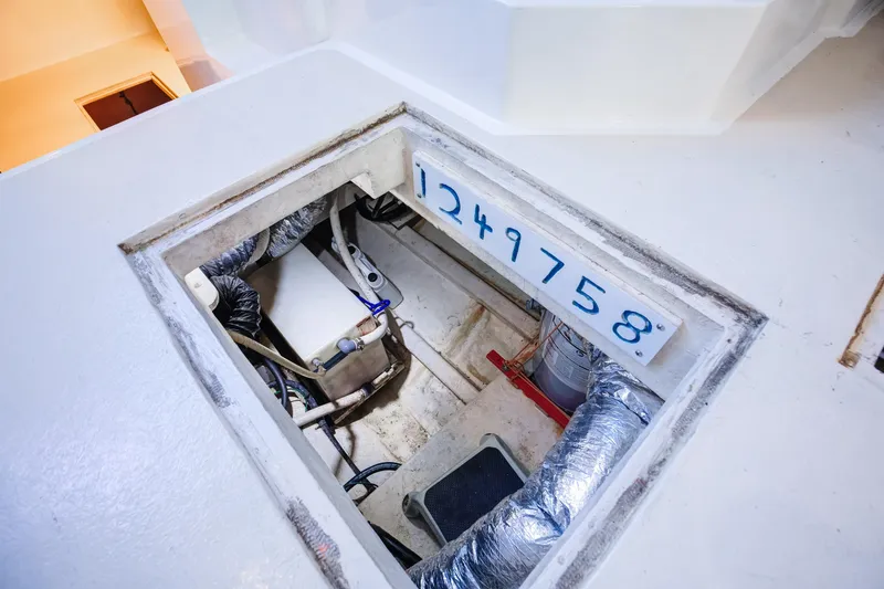 Slide: The Image of Engine compartment of 2014 Chesapeake 46 Trawler with visible serial number and components. - 29