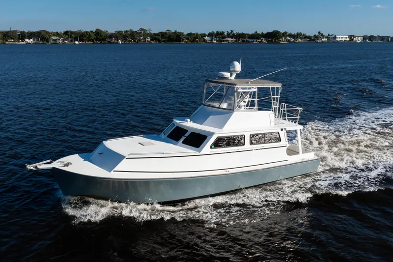 Slide: The Image of 2014 Chesapeake 46 Trawler cruising on open water under clear skies. - 35