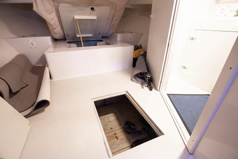 Slide: The Image of 2014 Chesapeake 46 Trawler interior with open hatch and storage space. - 5
