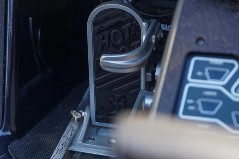 Slide: The Image of Close-up of 2021 Skeeter FXR20 Apex boat throttle control labeled "HOT FOOT." - 16