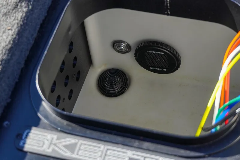 Slide: The Image of 2021 Skeeter FXR20 Apex boat compartment with oxygenator and wiring. - 28