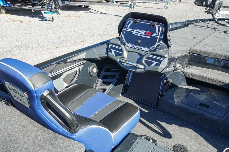 Slide: The Image of 2021 Skeeter FXR20 Apex boat interior with blue and black seating and advanced dashboard. - 29
