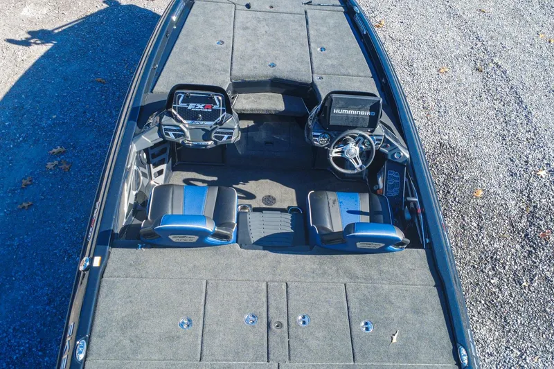 Slide: The Image of 2021 Skeeter FXR20 Apex boat interior with dual seats and Humminbird electronics. - 5