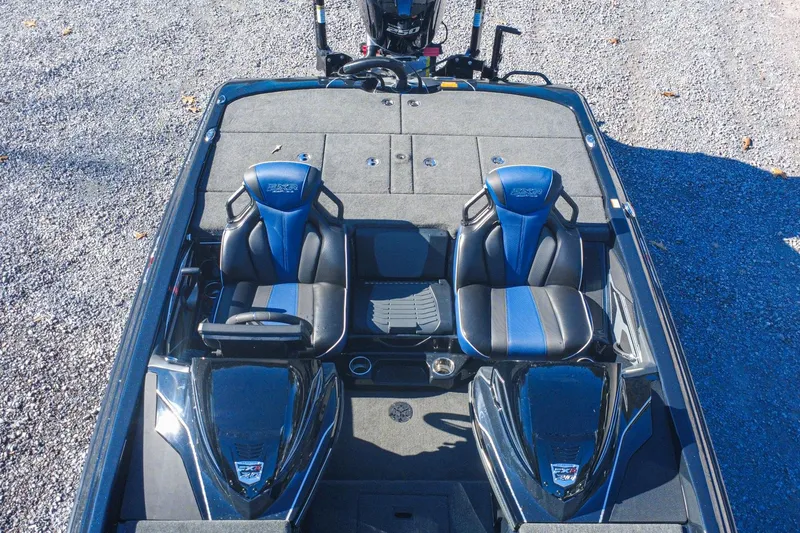 Slide: The Image of 2021 Skeeter FXR20 Apex boat interior with dual blue and black seats, overhead view. - 6