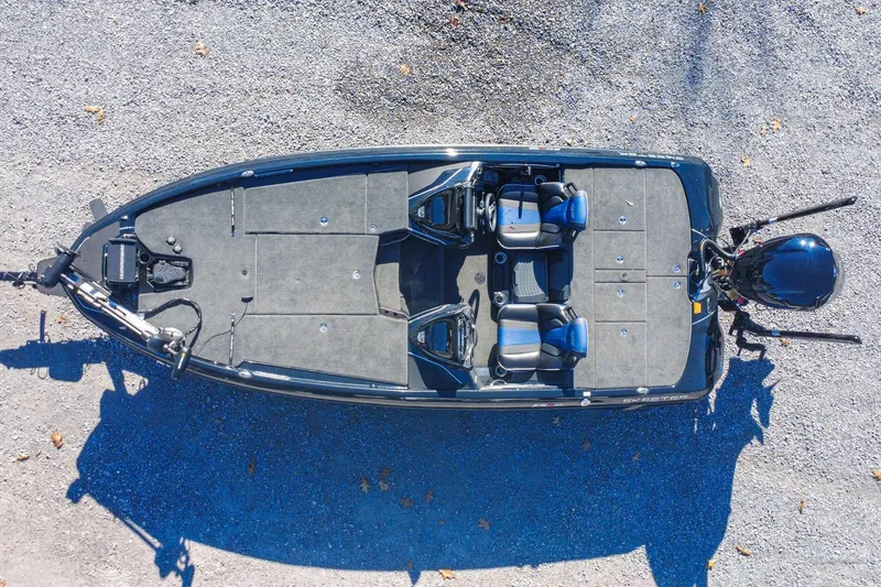 Slide: The Image of Overhead view of 2021 Skeeter FXR20 Apex fishing boat on gravel. - 7