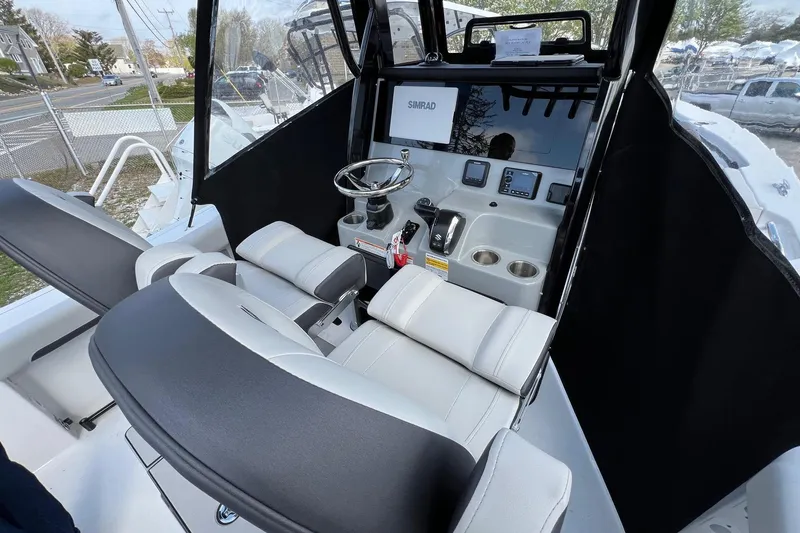 Slide: The Image of 2026 Sea Pro 245FLX Sandbar boat interior with modern helm and seating. - 14