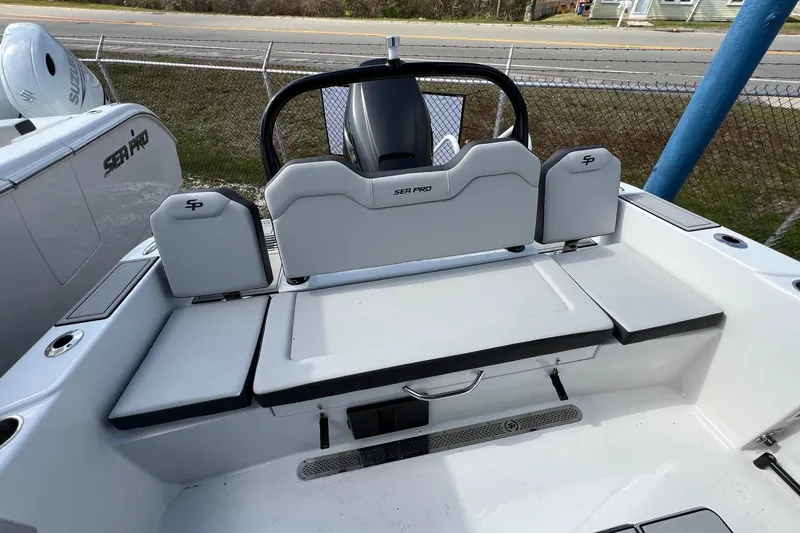 Slide: The Image of 2026 Sea Pro 245FLX Sandbar boat interior with sleek seating and modern design. - 16