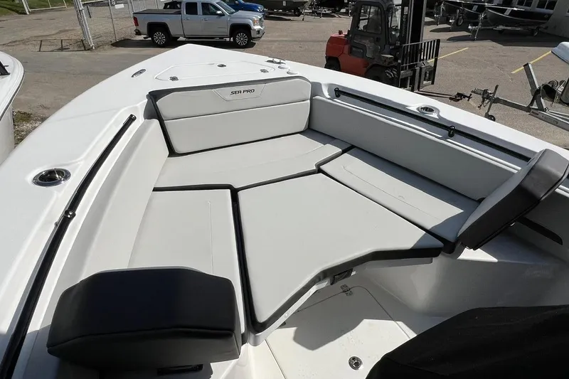 Slide: The Image of 2026 Sea Pro 245FLX Sandbar boat interior with cushioned seating and sleek design. - 20
