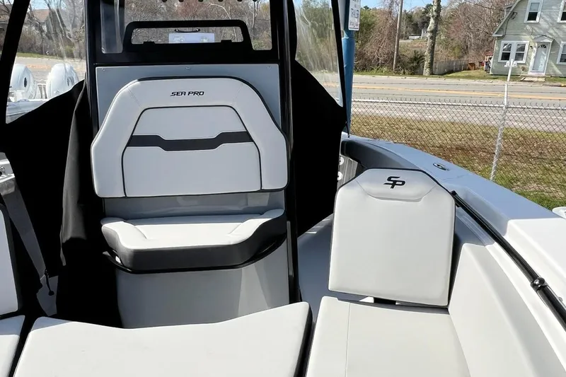 Slide: The Image of 2026 Sea Pro 245FLX Sandbar boat interior with modern seating and sleek design. - 24