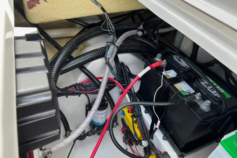 Slide: The Image of Electrical system of 2026 Sea Pro 245FLX Sandbar boat, featuring battery and wiring components. - 32