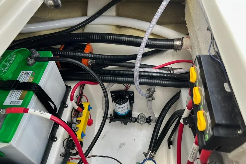 Slide: The Image of Electrical and mechanical components inside a 2026 Sea Pro 245FLX Sandbar boat. - 34