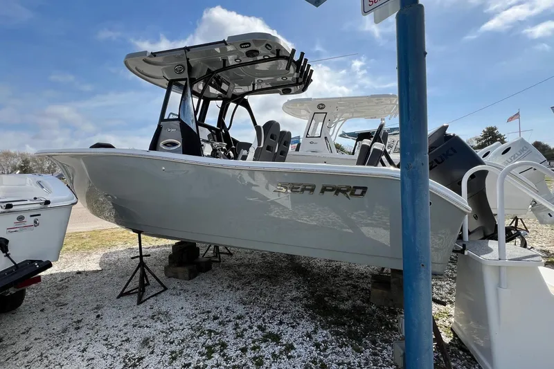 The Image of 2026 Sea Pro 245FLX Sandbar boat displayed outdoors on a sunny day. - 7