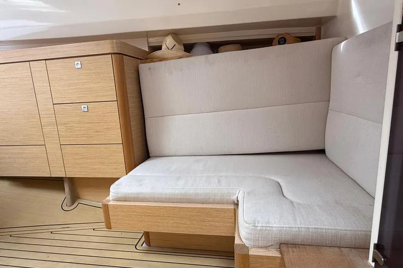 Slide: The Image of Interior of 2013 Fjord 40' Open yacht with beige seating and wooden cabinetry. - 103