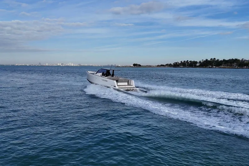 Slide: The Image of 2013 Fjord 40' Open yacht cruising on open water under a blue sky. - 108