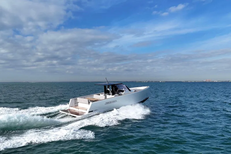Slide: The Image of 2013 Fjord 40' Open yacht cruising on open water under a blue sky. - 111