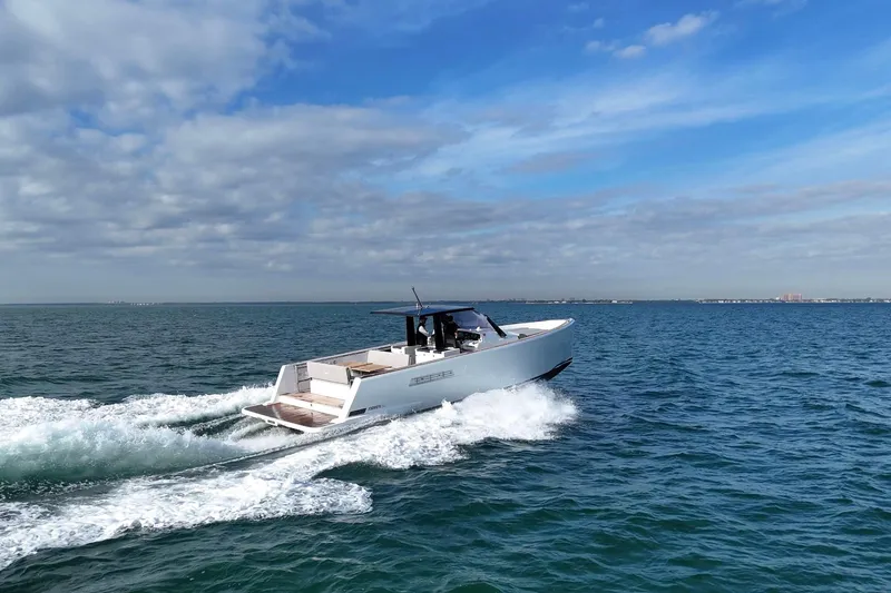 Slide: The Image of 2013 Fjord 40' Open yacht cruising on open water under a blue sky. - 112