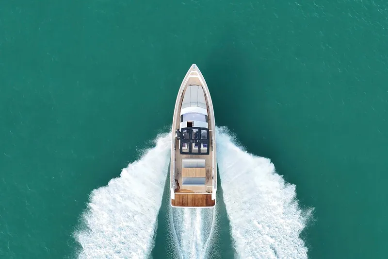 Slide: The Image of Aerial view of 2013 Fjord 40' Open yacht cruising on turquoise water. - 15
