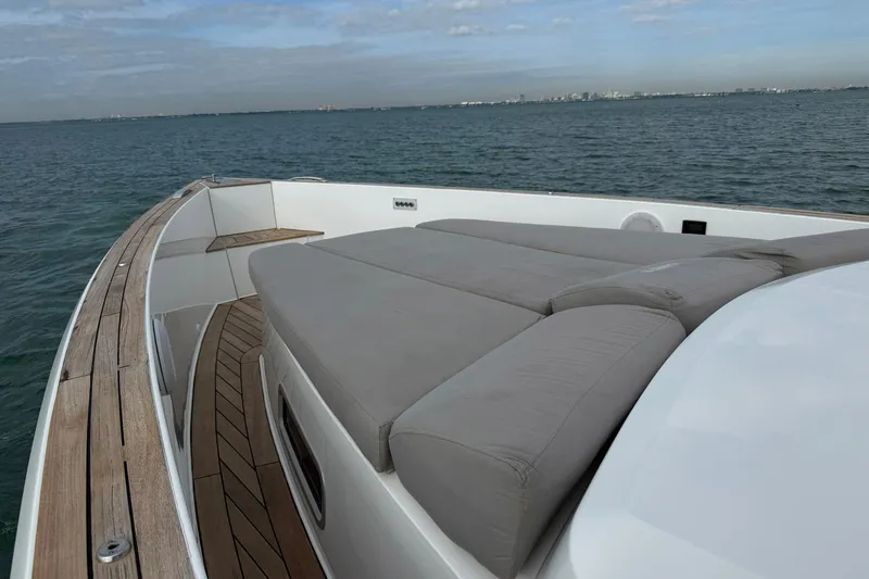 Slide: The Image of 2013 Fjord 40' Open yacht with spacious deck and cushioned seating on calm waters. - 27