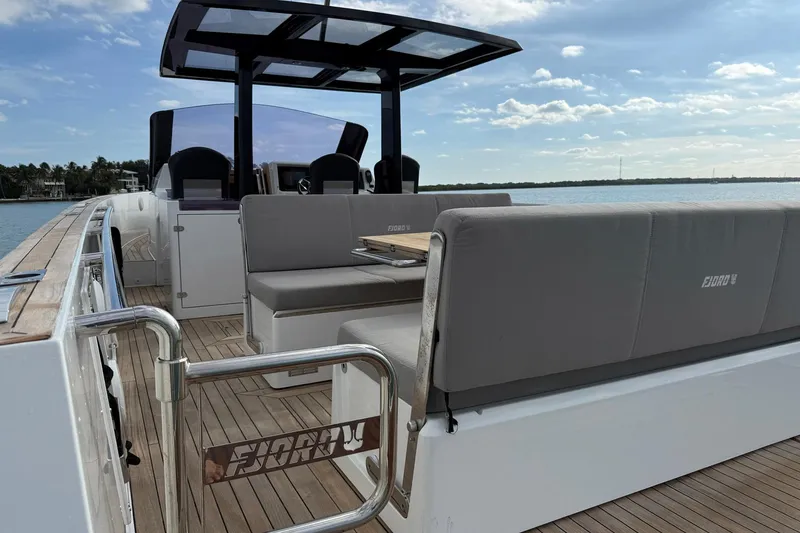 Slide: The Image of 2013 Fjord 40' Open yacht with sleek seating and modern design on a sunny day. - 33