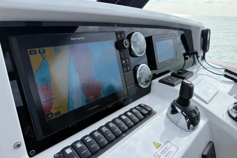 Slide: The Image of Control panel of a 2013 Fjord 40' Open boat with navigation screens. - 38