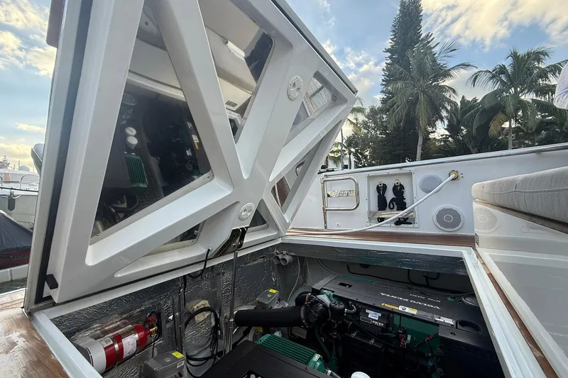 Slide: The Image of Engine compartment of a 2013 Fjord 40' Open yacht, showcasing mechanical components and storage. - 50