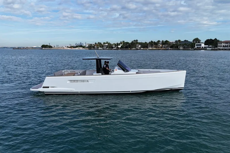 Slide: The Image of 2013 Fjord 40' Open yacht cruising on calm waters under a partly cloudy sky. - 51