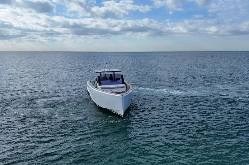 Slide: The Image of 2013 Fjord 40' Open yacht cruising on open sea under cloudy sky. - 57