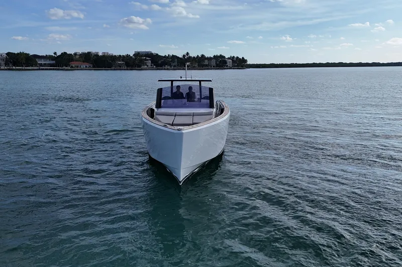 Slide: The Image of 2013 Fjord 40' Open yacht cruising on calm waters under a clear sky. - 63