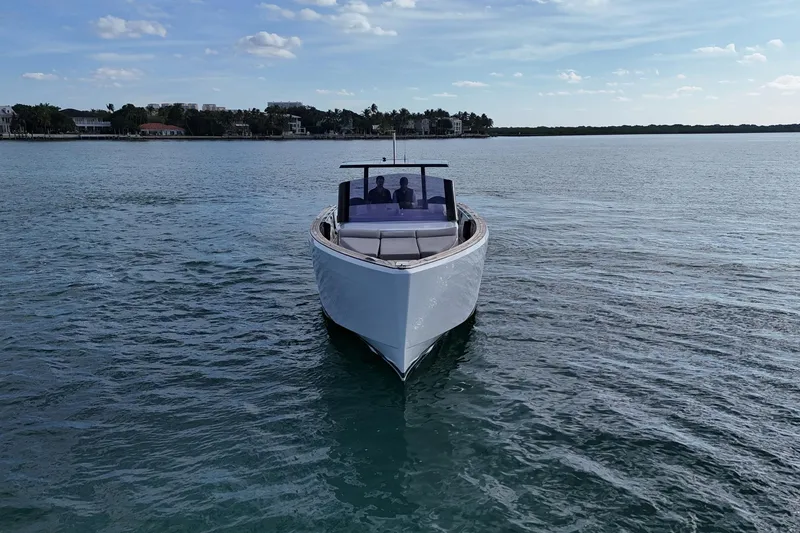 Slide: The Image of 2013 Fjord 40' Open yacht cruising on calm waters under a clear sky. - 64
