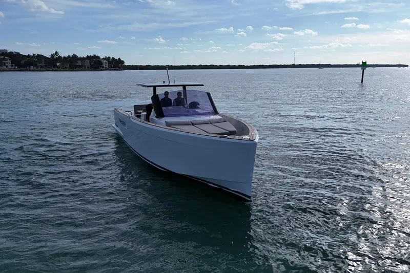Slide: The Image of 2013 Fjord 40' Open boat cruising on calm waters under a clear sky. - 65
