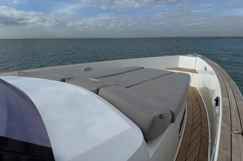 Slide: The Image of 2013 Fjord 40' Open yacht with spacious deck and sunbathing area on calm sea. - 77