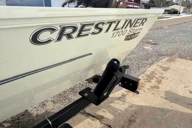 Slide: The Image of 2026 Crestliner 1700 Storm boat on trailer, parked on a paved surface. - 10