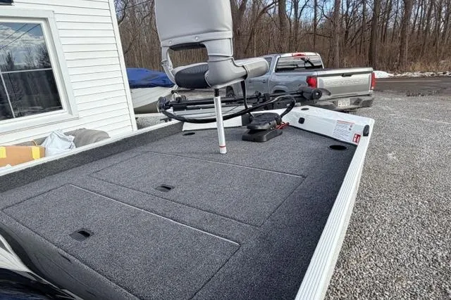 Slide: The Image of 2026 Crestliner 1700 Storm fishing boat with elevated seat, parked outdoors. - 7