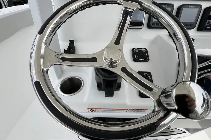 Slide: The Image of Steering wheel of 2026 Sea Pro 262 Offshore boat with control panel. - 15