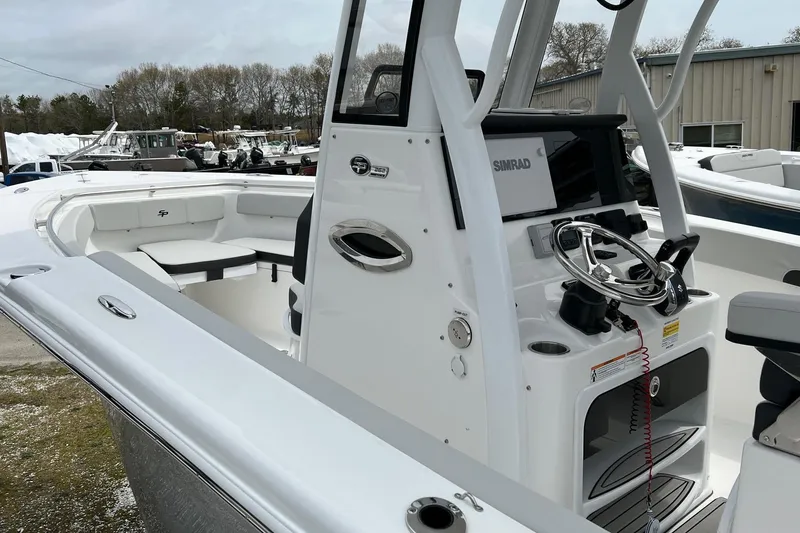 Slide: The Image of 2026 Sea Pro 262 Offshore boat with modern helm and seating area. - 18