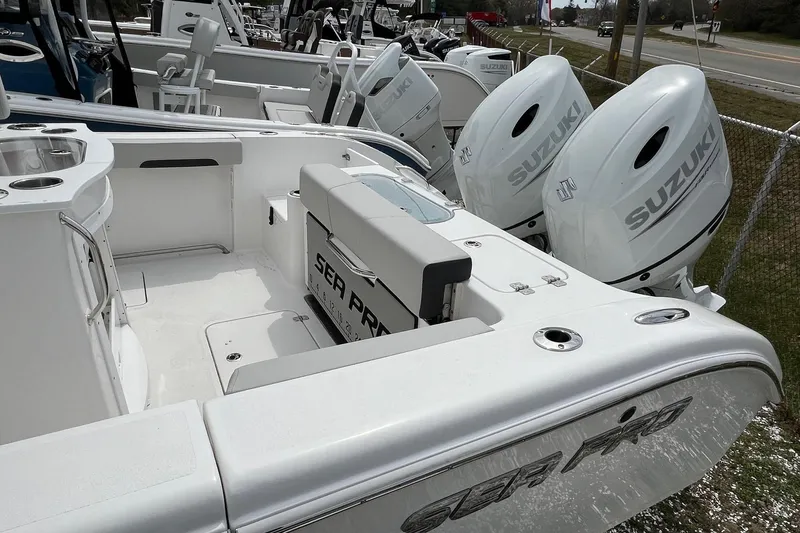 Slide: The Image of 2026 Sea Pro 262 Offshore boat with dual Suzuki outboard motors, showcasing spacious deck design. - 20