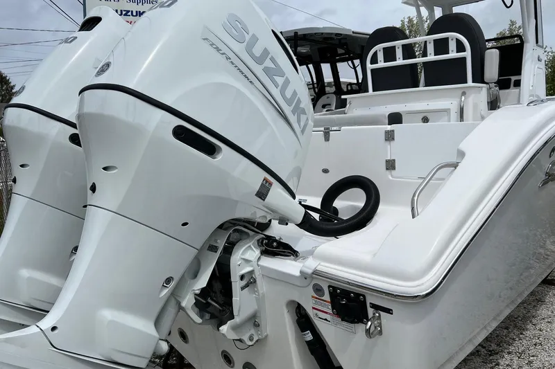 Slide: The Image of 2026 Sea Pro 262 Offshore boat with dual Suzuki outboard engines. - 22