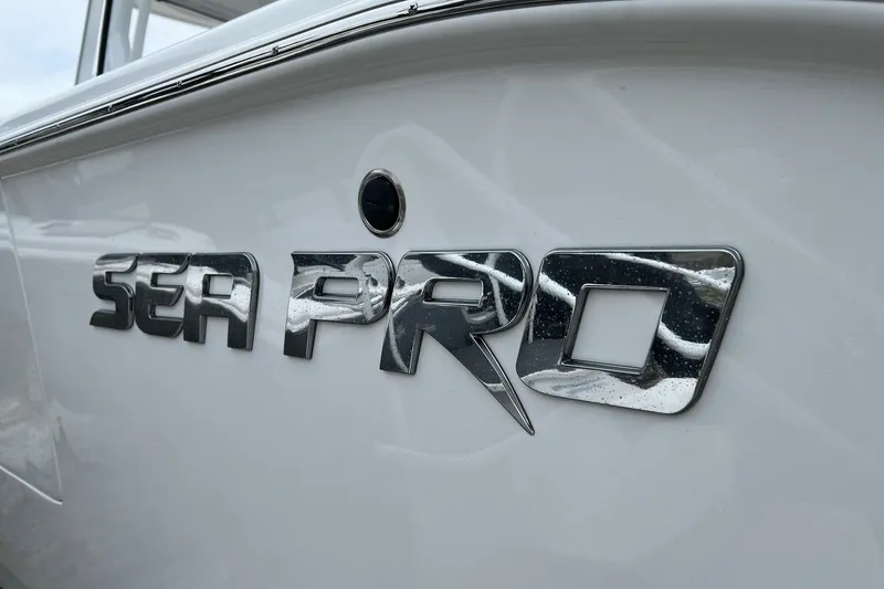 Slide: The Image of Close-up of 2026 Sea Pro 262 Offshore boat logo on white hull. - 24