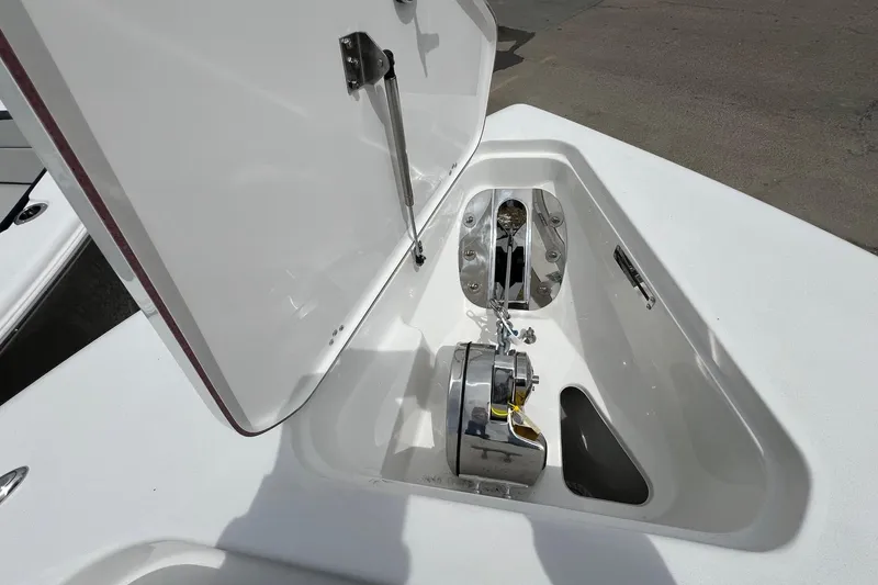 Slide: The Image of Anchor compartment of 2026 Sea Pro 262 Offshore boat, featuring a winch system. - 27