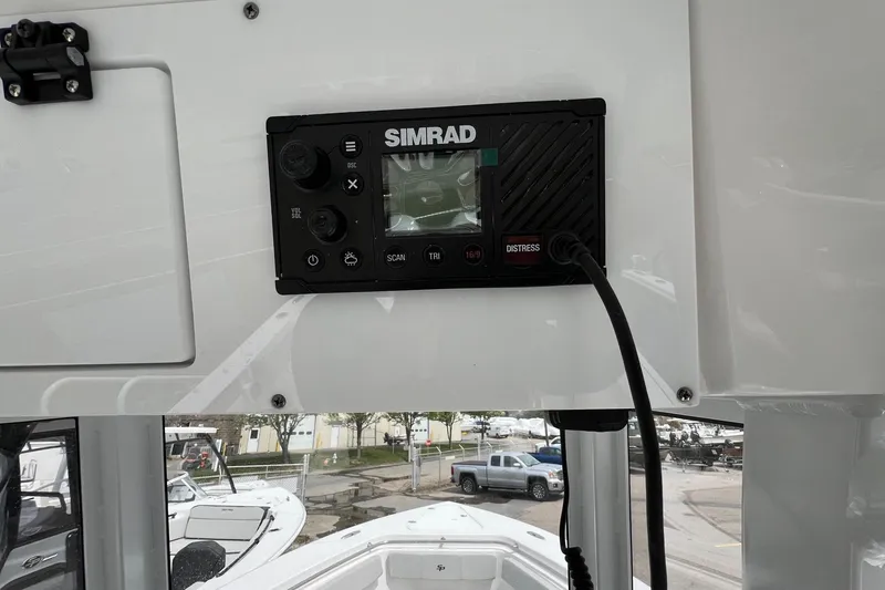 Slide: The Image of Simrad marine radio on 2026 Sea Pro 262 Offshore boat dashboard. - 28